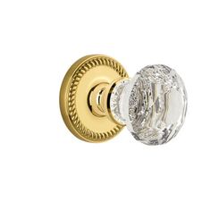 an image of a door knob with crystal glass on the front and back side, in gold