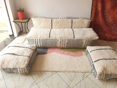 a group of four rugs sitting on top of a floor