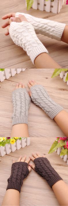 two women's hands with knitted mittens and gloves on top of a wooden floor