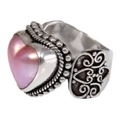 Delightfully romantic this sterling silver cocktail ring from Buana in Bali features a naturally pink heart-shaped cultured mabe pearl. The artisan surrounds the pearl with an intricate bead and rope bezel and sets it on an ornate band with exquisite wire work that is emphasized by an oxidized background. Pink Pearl Jewelry, Pearl Cocktail Ring, Romantic Heart, Mabe Pearl, Heart Dangle Earrings, Funky Jewelry, Handmade Rings, Jewelry Packaging, Handmade Sterling Silver