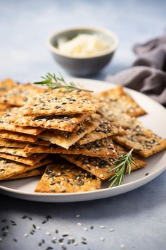 crackers with herbs and butter on a white plate