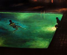 two people are swimming in an empty pool at night with lights shining on the water