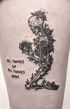 a person with a skeleton tattoo on their leg and the words, all things go thing's gone