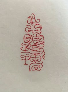 a piece of paper with red ink on it that says happy new year written in cursive writing