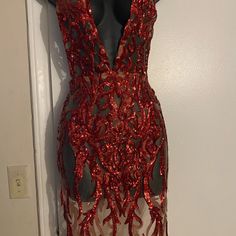 a red dress with sequins on it