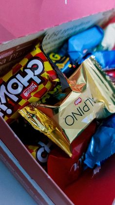 a pink box filled with assorted candy