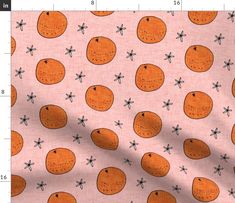 a pink background with oranges and bees on it, as well as a ruler