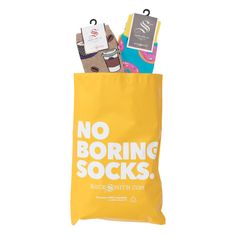 a yellow bag with no boring socks on it that says rocks n's north coast