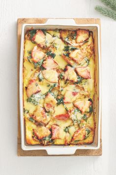 a casserole dish with potatoes and spinach