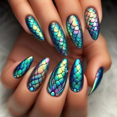 Nails adorned with mesmerizing mermaid scale designs. The nails shimmer with iridescent shades of blue, green, and purple, resembling the scales of a mystical mermaid tail. Each scale is meticulously painted, creating a dazzling underwater effect that catches the light with every movement. Most Popular Nail Designs, Mermaid Tail Nail Art, Spooky Mermaid Nails, Purple And Green Cat Eye Nails, Dragon Scale Nails, Dark Mermaid Nails Design, Mermaid Blue Nails, Dark Mermaid Nails Acrylic, Peacock Nail Designs