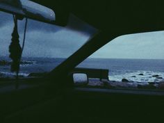 the view from inside a car looking out at the ocean