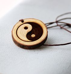 Oriental Yin Yang, Yin yang pendant necklace, Pendant Necklaces, Symbol Necklaces, Yin Yang, Zen, yoga, Meditation Gift, spiritual jewelry This wood pendant is cut from raw tree, it has delightful and nice smell. You can feel it as you are in the forest. This Ying yang engraved symbol wood pendant necklace is  designed by me Katie. The leather necklace is adjustable. it is handmade item. That is the new idea to bring this to the interested people. Hope i can help you get it into what you want and what you thought about. Zen Yoga, Symbol Necklace, Meditation Gifts, Ying Yang, Wood Pendant, Spiritual Jewelry, Leather Necklace, Smell Good, Yoga Meditation