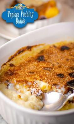 a close up of a bowl of food on a table with a spoon in it