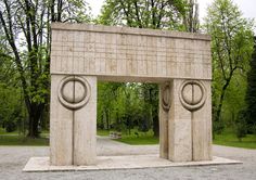 a large stone structure in the middle of a park