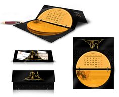 an image of a desk calendar with gold foil on it and black paper in the middle