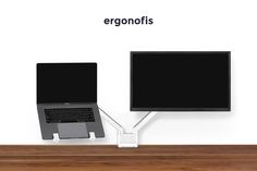 two laptops connected to each other on a desk with ergonfits logo above them