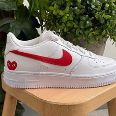 Upgrade your sneaker game with the stylish and iconic Red Heart Custom Air Force 1s. Featuring a pristine white leather upper paired with tonal red swoosh and heart detailing, these shoes are sure to draw attention to your footwear collection. With a foam sole for comfort and Nike cushioning, these shoes are as comfortable as they are stylish.

iends, family, that special someone, or yourself ✨
- Exactly as shown in the pictures.
- Brand New & Authentic. 💯 
- Hand Painted with attention to detail. 👨‍🎨 
- Waterproof and Flexible. ❤️ 
- Unisex model. Please refer to the Size Chart.
- Free Worldwide Shipping. ✈︎ Shoe Embroidery, Shoe Artwork, Air Force 1s, Custom Air Force 1, Sneaker Games, Footwear Collection, Custom Shoes, Air Force 1, Red Heart