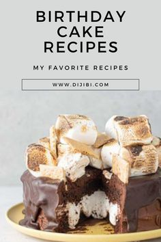 a birthday cake with marshmallows and chocolate frosting is on a yellow plate