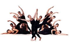 a group of dancers are posing for the camera