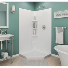 a bathroom with green walls and white fixtures