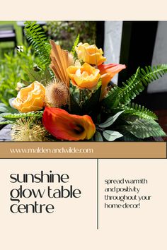 a vase filled with flowers sitting on top of a wooden table