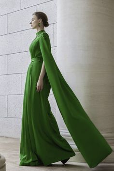 Featuring a stunning floor length design, the dress is a must-have for any formal occasion. Made with luxurious silk and tailored with pleats, this dress exudes elegance and sophistication. Perfect for making a statement and turning heads at any event. Floor-length Maxi Dress With Sweep Train For Banquet, Green Pleated Bodice Evening Dress For Gala, Green Evening Dress With Pleated Bodice For Gala, Floor-length Silk Maxi Dress For Evening, Formal Silk Floor-length Maxi Dress, Silk Floor-length Maxi Dress For Evening, Evening Floor-length Gown With Sweep Train, Formal Evening Dress With Cape Sleeves, Cocktail Evening Dress With Pleated Bodice