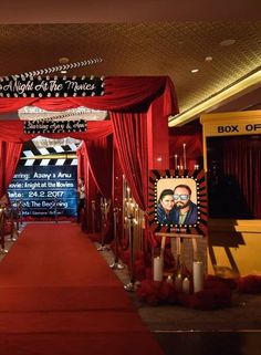 a red carpeted hall with pictures and decorations