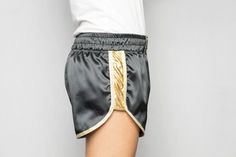 Short shorts ZAT GOLD DUST satin polyester black bands sides fabric gold Bordered by white gold bias Badge belt logo ZAT embroidered black on gold Elastic belt Size S (36/38) Materials: -black satin: polyester 97%, elastane 3% -golden fabric: polyamide 95%, elastane 5% Machine washable at 30oC upside down Gentle ironing Sportswear and canon Can be ordered in other sizes Made in France Christmas gift / Gift for her / Gift for him / Birthday gift Short Satin, Satin Noir, Gold Dust, Elastic Belt, Gold Border, Short Girls, Black Satin, Short Outfits, Made In France