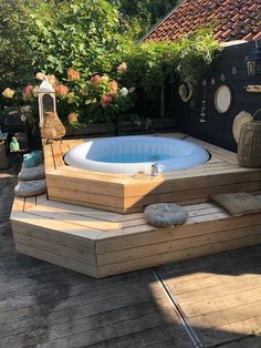 a hot tub sitting on top of a wooden deck