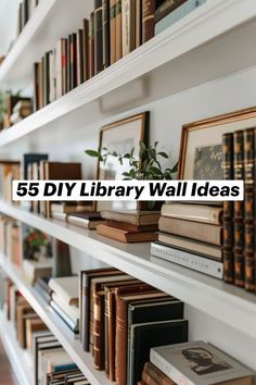 a book shelf filled with lots of books next to a wall full of framed books