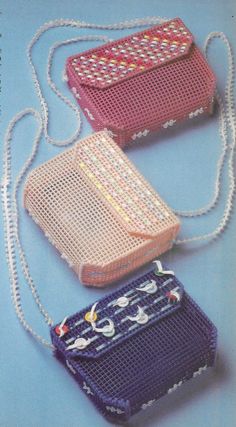 three purses are shown on a blue background, one is crocheted and the other is beaded