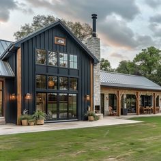 a large black house with lots of windows