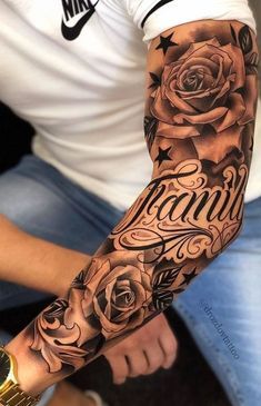 a man with a rose and name tattoo on his arm is sitting in front of the camera