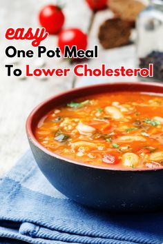 a bowl of soup on top of a blue towel with the words easy one pot meal to lower cholesterol