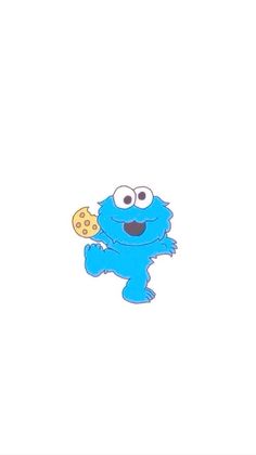 the cookie monster is holding a cookie in his hand