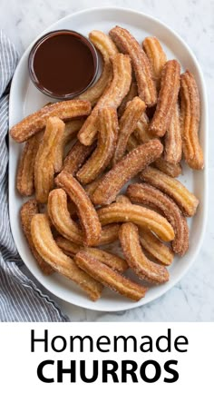 churros and dipping sauce on a white plate