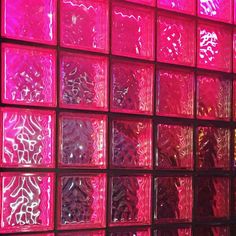 a wall made out of pink glass blocks