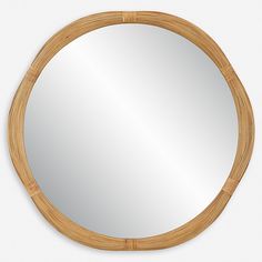 a round mirror made out of bamboo with an oval frame on the top and bottom