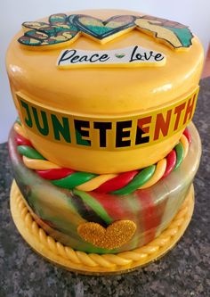 there is a cake made to look like a hat on top of each other with the words juneteeth written on it