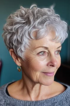 If you’re looking for something stylish, opt for a short, curly pixie cut in silver. This haircut showcases the texture of curly hair while adding a modern and sophisticated touch with the silver color. Click here to check out more flattering hairstyles for women over 70. Curly Grey Hair Natural Curls Short Hairstyles, Curly Hairstyles For Women Over 70, Short Haircuts For Naturally Wavy Hair, Curly Hair Women Short, Short Hairstyles For Women With Curly Hair, Wedge Haircut Curly Hair, Short Curly Hairstyles For Women Over 60, Short Hair Styles Pixie Curly, Short Pixie Haircuts Curly Hair