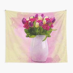 a white vase filled with lots of purple and yellow flowers on top of a pink background