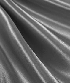 a black and white photo of a satin fabric