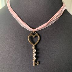 Necklace Skeleton Key Heart Pink Ribbon Choker 16” Pink Ribbon Choker With Lobster Clasp Closure And 2” Extension Chain Antique Bronze Gold Heart Skeleton Key Pendant With Applied Rhinestone Chain Nwot Handmade Heart Skeleton Key, Magical Clothing, Heart Skeleton, Magical Clothes, Key Heart, Ribbon Choker, Rhinestone Chain, Skeleton Key, Bronze Gold