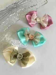 These bows are just gorgeous. I made them with satin and organza ribbon and a high-quality round buckle. The bows measure approx. 3.5" x 2".NO CLIP OR HEADBAND ATTACHEDThe bow would be perfect to decorate headbands or hair clips. This listing is for 1 bow in your color choice:MAUVE/IVORYAQUA/GOLDIVORY/OLIVEFor more available colors, please click on this link:https://www.etsy.com/shop/MCsupplies/search?search_query=199&order=date_desc&view_type=gallery&ref=shop_search I will be postin Hair Clip Accessories, Bow Baby Shower, Accessories Craft, Wedding Cake Decorations, Baby Bow, Mesh Ribbon, Organza Ribbon, Elastic Headbands