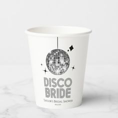 a paper cup with disco bride logo on it