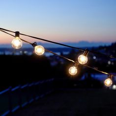 some lights that are hanging from a wire