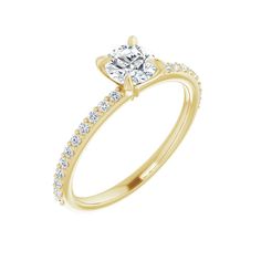 a yellow gold engagement ring with diamonds on the side