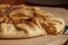 a close up of a pizza on a cutting board