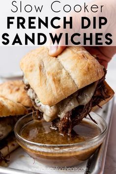 a close up of a sandwich in a glass bowl with the words slow cooker french dip sandwiches