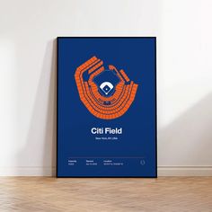 an orange and blue poster with the words citi field on it in front of a white wall